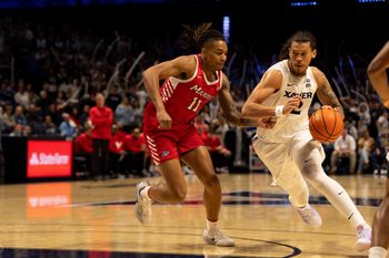 Xavier Musketeers forward Tre Carroll (12) drives on Marist Red Foxes forward Jaden Daughtry (11) in the second half of the basketball game at the Cintas Center on Nov. 3, 2025.