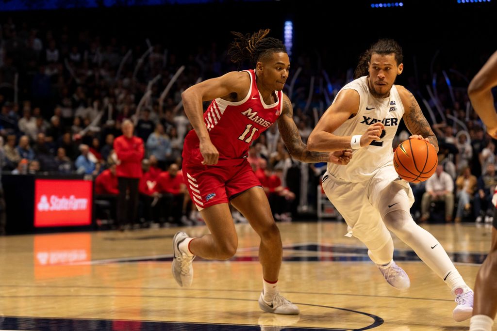 Xavier Musketeers forward Tre Carroll (12) drives on Marist Red Foxes forward Jaden Daughtry (11) in the second half of the basketball game at the Cintas Center on Nov. 3, 2025.