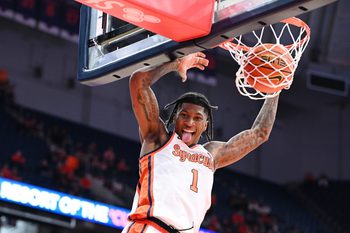 Nov 3, 2025; Syracuse, New York, USA; Syracuse Orange forward Donnie Freeman (1) dunks the ball in the second half against the Binghamton Bearcats at the JMA Wireless Dome. Mandatory Credit: Mark Konezny-Imagn Images