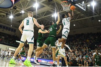 UNCW's #4 Nolan Hodge puts in a layup as UNCW took on Mount Olive Nov. 3, 2025 at Trask Coliseum in Wilmington, N.C. KEN BLEVINS/STARNEWS