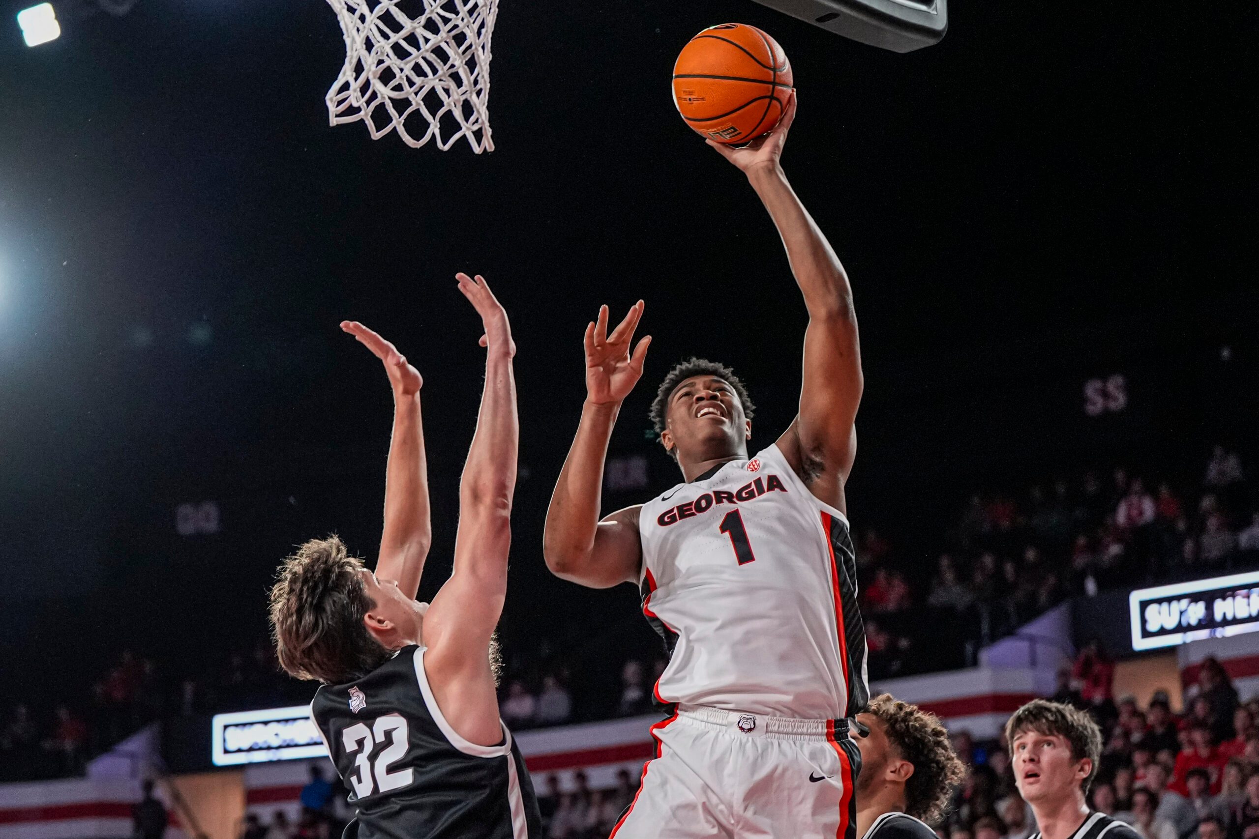 Nov 3, 2025; Athens, Georgia, USA; Georgia Bulldogs forward Kareem Stagg (1) shoots over Bellarmine Knights forward Jack Karasinski (32) at Stegeman Coliseum. Mandatory Credit: Dale Zanine-Imagn Images