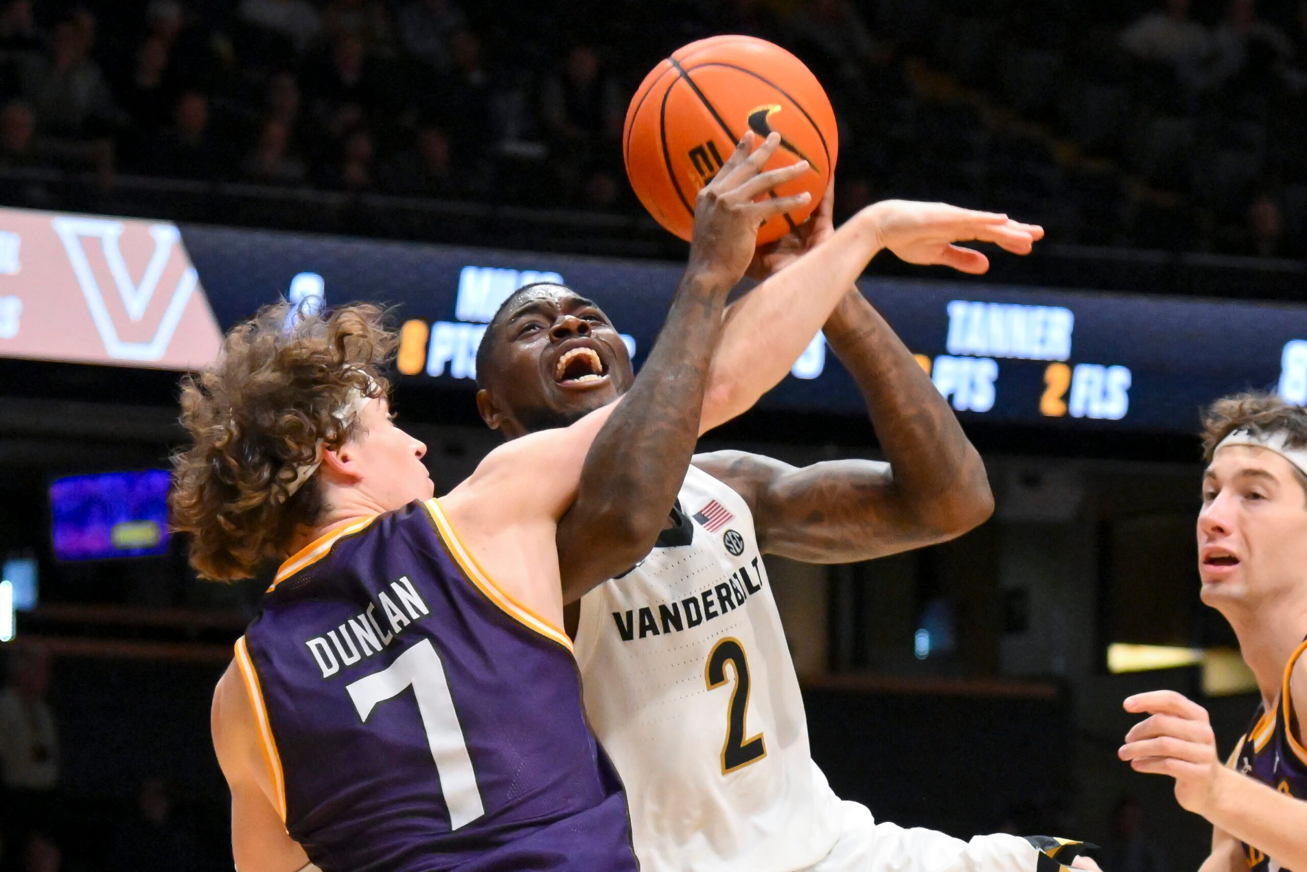 Nov 3, 2025; Nashville, Tennessee, USA;  Lipscomb Bisons guard Ethan Duncan (7) fouls Vanderbilt Commodores guard Duke Miles (2) during the second half at Memorial Gymnasium. Mandatory Credit: Steve Roberts-Imagn Images