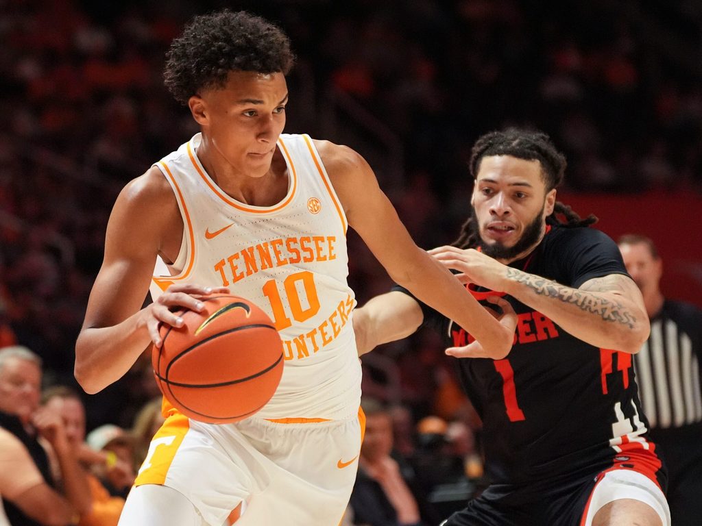 Tennessee forward Nate Ament (10) tries to move past Mercer guard Zaire Williams (1) during an NCAA college basketball game on November 3, 2025, in Knoxville, Tenn.
