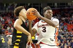 Nov 3, 2025; Auburn, Alabama, USA;  Auburn Tigers forward Keshawn Murphy (3) grabs a rebound over Bethune-Cookman Wildcats forward Daniel Rouzan (23) during the second half at Neville Arena.  Mandatory Credit: John Reed-Imagn Images