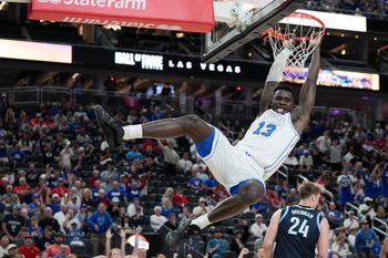 Nov 3, 2025; Las Vegas, Nevada, USA; BYU Cougars center Keba Keita (13) dunks against the Villanova Wildcats  during the first half of the Hall of Fame Series game at T-Mobile Arena. Mandatory Credit: Candice Ward-Imagn Images
