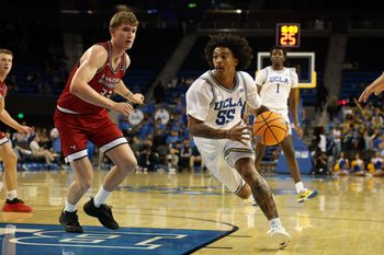 Nov 3, 2025; Los Angeles, California, USA;  UCLA Bruins guard Skyy Clark (55) drives to the basket against Eastern Washington Eagles forward Emmett Marquardt (33) during the second half at Pauley Pavilion presented by Wescom Financial. Mandatory Credit: Kiyoshi Mio-Imagn Images