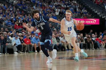 Nov 3, 2025; Las Vegas, Nevada, USA; BYU Cougars guard Richie Saunders (15) dribbles the ball against Villanova Wildcats guard Devin Askew (5) during the first half of the Hall of Fame Series game at T-Mobile Arena. Mandatory Credit: Candice Ward-Imagn Images