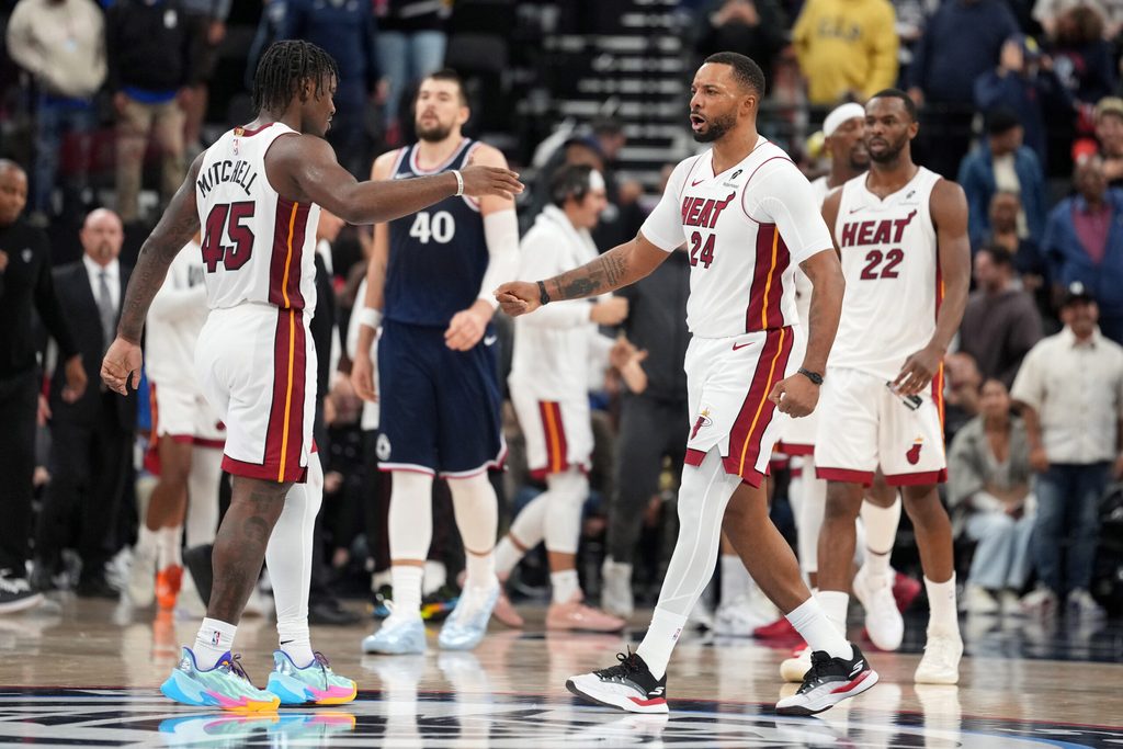 Nov 3, 2025; Inglewood, California, USA; Miami Heat guard Norman Powell (24) celebrates with guard Davion Mitchell (45) at the end of the game against the LA Clippers at Intuit Dome. Mandatory Credit: Kirby Lee-Imagn Images