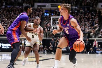 Evansville Purple Aces guard Leif Moeller (6) rushes up the court Tuesday, Nov. 4, 2025, during the game at Mackey Arena in West Lafayette. The Purdue Boilermakers defeated the Evansville Purple Aces, 82-51.