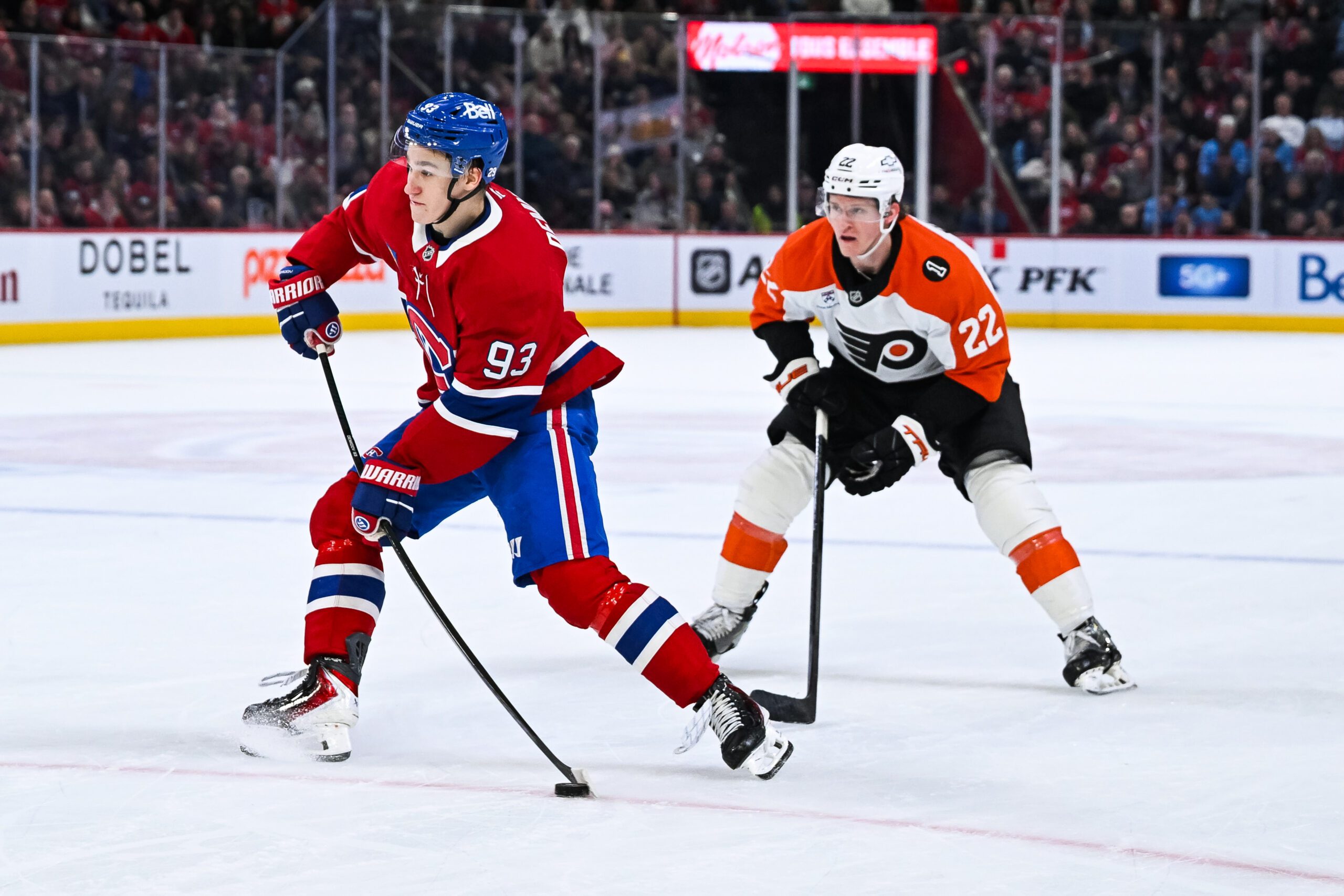 Nov 4, 2025; Montreal, Quebec, CAN; Montreal Canadiens right wing Ivan Demidov (93) shoots the puck against Philadelphia Flyers center Christian Dvorak (22) during the second period at Bell Centre. Mandatory Credit: David Kirouac-Imagn Images
