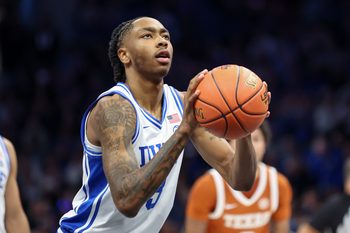 Nov 4, 2025; Charlotte, North Carolina, USA; Duke Blue Devils guard Isaiah Evans (3) shoots a free throw against the Texas Longhorns during the first half of the Dick Vitale’s Invitational game at Spectrum Center. Mandatory Credit: Cory Knowlton-Imagn Images
