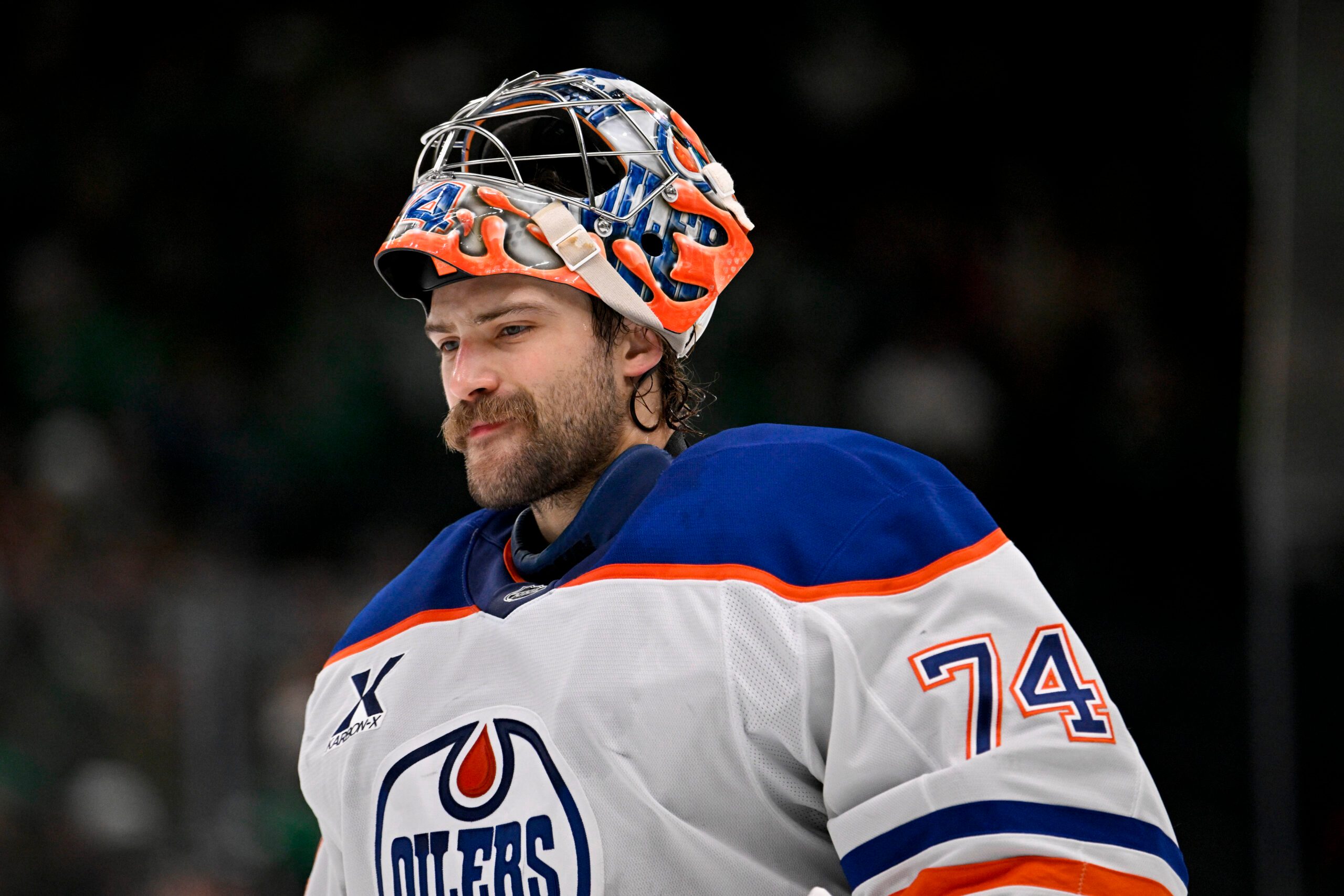 Nov 4, 2025; Dallas, Texas, USA; Edmonton Oilers goaltender Stuart Skinner (74) skates back on the ice during the overtime period against the Dallas Stars at the American Airlines Center. Mandatory Credit: Jerome Miron-Imagn Images