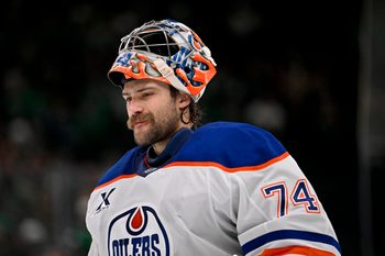 Nov 4, 2025; Dallas, Texas, USA; Edmonton Oilers goaltender Stuart Skinner (74) skates back on the ice during the overtime period against the Dallas Stars at the American Airlines Center. Mandatory Credit: Jerome Miron-Imagn Images
