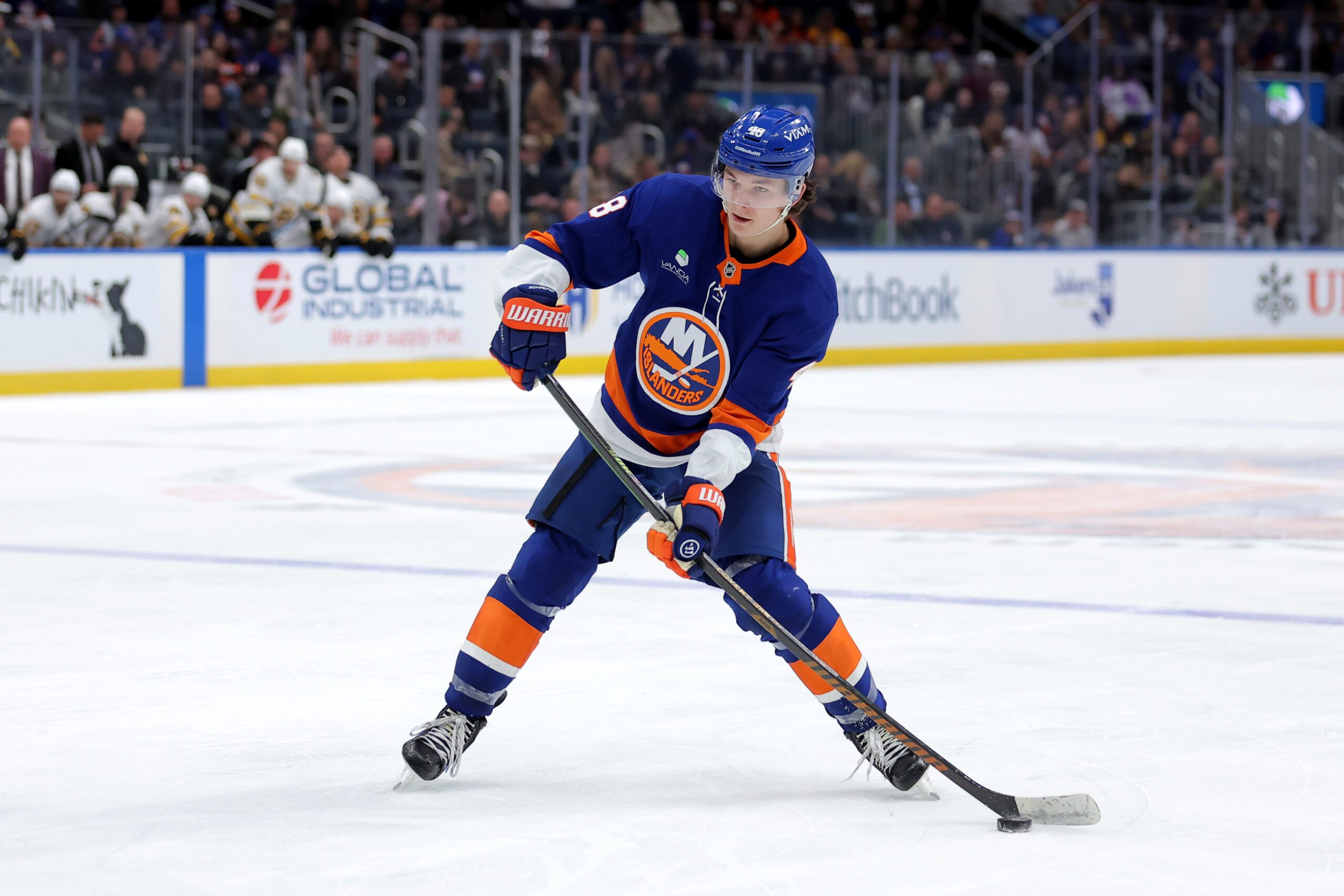 Nov 4, 2025; Elmont, New York, USA; New York Islanders defenseman Matthew Schaefer (48) skates with the puck against the Boston Bruins during the second period at UBS Arena. Mandatory Credit: Brad Penner-Imagn Images