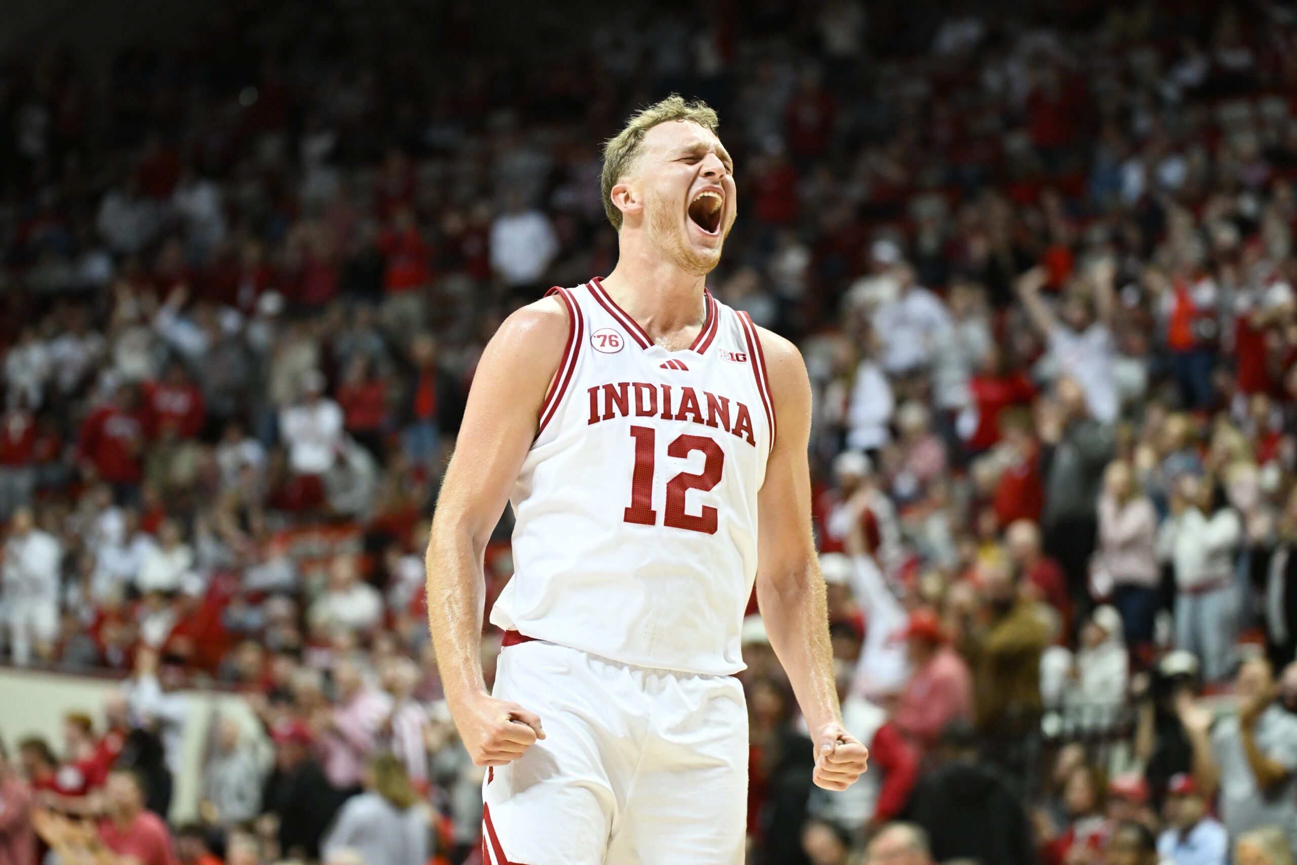 Nov 5, 2025; Bloomington, Indiana, USA; Indiana Hoosiers forward Tucker Devries (12) celebrates after a play during the second half against the Alabama A&M Bulldogs at Simon Skjodt Assembly Hall. Mandatory Credit: Robert Goddin-Imagn Images