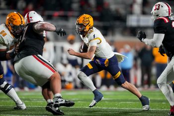 Nov 5, 2025; Muncie, Indiana, USA;  Kent State Golden Flashes quarterback Dru Deshields (12) runs with the ball against the Ball State Cardinals in the second half at Scheumann Stadium. Mandatory Credit: Aaron Doster-Imagn Images