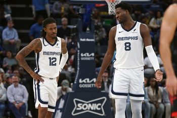 Nov 5, 2025; Memphis, Tennessee, USA; Memphis Grizzlies forward/center Jaren Jackson Jr. (8) talks with guard Ja Morant (12) during the second quarter against the Houston Rockets at FedExForum. Mandatory Credit: Petre Thomas-Imagn Images