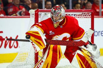 Nov 5, 2025; Calgary, Alberta, CAN; Calgary Flames goaltender Dustin Wolf (32) makes a save against the Columbus Blue Jackets during the third period at Scotiabank Saddledome. Mandatory Credit: Sergei Belski-Imagn Images