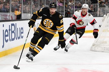 Nov 6, 2025; Boston, Massachusetts, USA; Boston Bruins center Sean Kuraly (52) skates against Ottawa Senators defenseman Tyler Kleven (43) during the first period at the TD Garden. Mandatory Credit: Brian Fluharty-Imagn Images