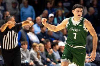Le Moyne Dolphins guard Trent Mosquera (7) gestures after hitting a 3-point shot in the first half of the NCAA game at the Cintas Center in Cincinnati on Nov. 6, 2025.