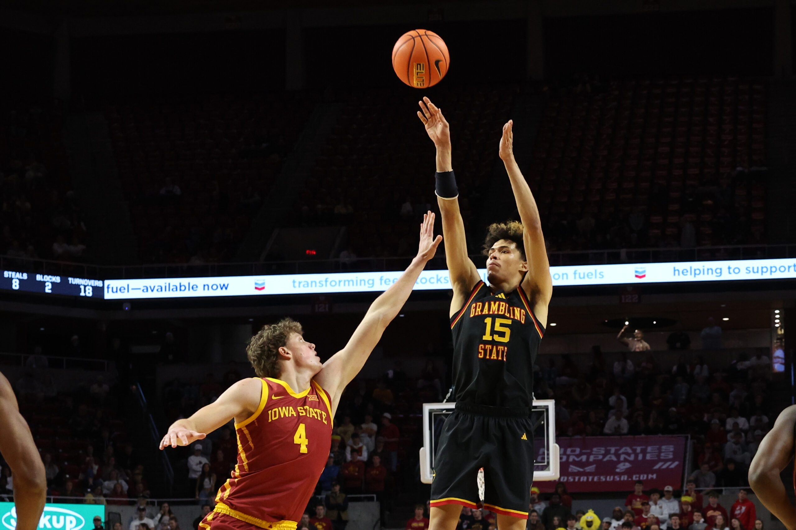 Nov 6, 2025; Ames, Iowa, USA; Grambling State Tigers forward Antonio Munoz (15) shoots over Iowa State Cyclones forward Eric Mulder (4) during the second half at James H. Hilton Coliseum. Mandatory Credit: Reese Strickland-Imagn Images