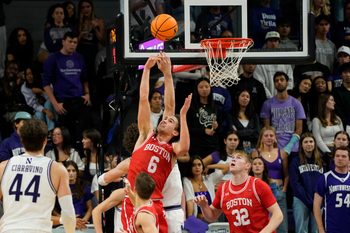 Nov 7, 2025; Evanston, Illinois, USA; Boston University Terriers guard Sam Hughes (6) grabs a rebound against the Northwestern Wildcats during the second half at Welsh-Ryan Arena. Mandatory Credit: David Banks-Imagn Images