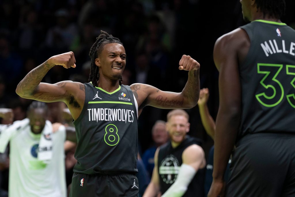 Nov 7, 2025; Minneapolis, Minnesota, USA; Minnesota Timberwolves guard Bones Hyland (8) reacts after forward Leonard Miller (33) makes a shot and gets fouled against the Utah Jazz in the second half at Target Center. Mandatory Credit: Jesse Johnson-Imagn Images