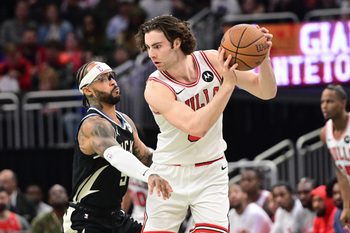 Nov 7, 2025; Milwaukee, Wisconsin, USA; Chicago Bulls guard Josh Giddey (3) looks for a shot against Milwaukee Bucks guard Gary Trent Jr. (5) in the 3rd quarter at Fiserv Forum. Mandatory Credit: Benny Sieu-Imagn Images