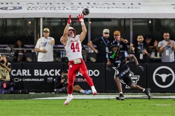 Nov 7, 2025; Orlando, Florida, USA; Houston Cougars running back Dean Connors (44) catches a pass in front of UCF Knights defensive back Antione Jackson (7) during the second half at Acrisure Bounce House. Mandatory Credit: Mike Watters-Imagn Images