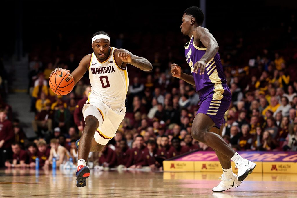 Nov 8, 2025; Minneapolis, Minnesota, USA; Minnesota Golden Gophers guard Chansey Willis Jr. (0) drives towards the basket as Alcorn State Braves guard Mike Jones (22) defends during the first half at Williams Arena. Mandatory Credit: Matt Krohn-Imagn Images