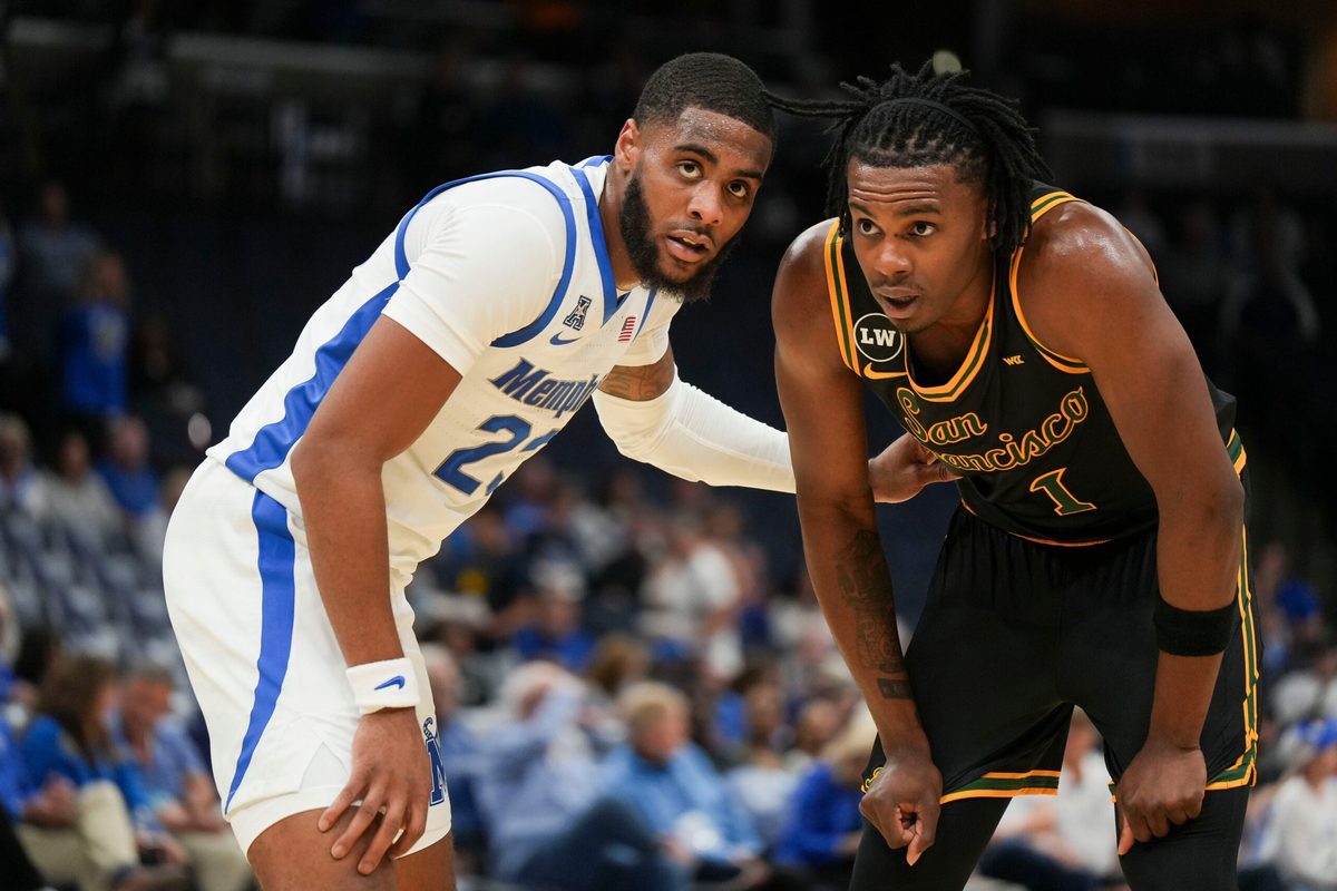 Memphis' Sincere Parker (23) guards San Franciso's Mookie Cook (1) on the inbound during the season opener for the Memphis Tigers versus San Francisco in FedExForum, Memphis, Tenn., on Saturday, Nov. 8, 2025.