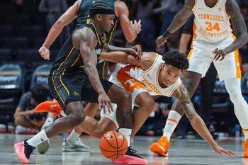 Tennessee guard Troy Henderson (24) trips over Northern Kentucky guard Donovan Oday (8) during a NCAA basketball game between the Tennessee Volunteers and Northern Kentucky Norse at Thompson-Boling Arena at Food City Center on Nov. 8, 2025.