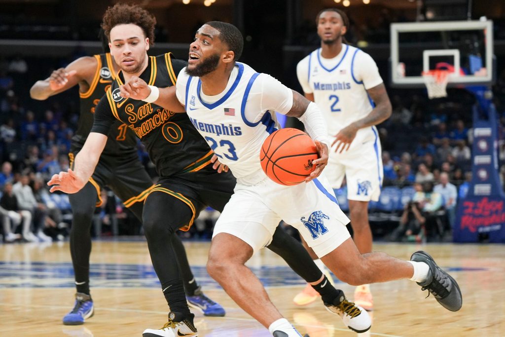 Memphis' Sincere Parker (23) tries to get past San Franciso's Ryan Beasley (0) during the season opener for the Memphis Tigers versus San Francisco in Fedex Forum, Memphis, Tenn., on Saturday, Nov. 8, 2025.