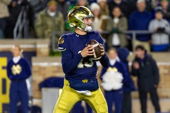 Nov 8, 2025; South Bend, Indiana, USA; Notre Dame Fighting Irish quarterback CJ Carr (13) looks to pass against the Navy Midshipmen during the first half at Notre Dame Stadium. Mandatory Credit: Michael Caterina-Imagn Images