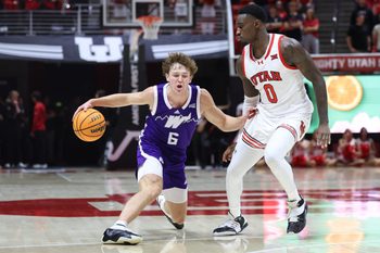 Nov 8, 2025; Salt Lake City, Utah, USA; Weber State Wildcats guard Trevor Hennig (6) dribbles against Utah Utes forward Seydou Traore (0) during the first half at Jon M. Huntsman Center. Mandatory Credit: Rob Gray-Imagn Images
