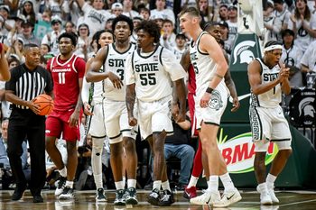 Michigan State's Coen Carr, center, and teammates celebrate after Carr drew an Arkansas foul during the second half on Saturday, Nov. 8, 2025, at the Breslin Center in East Lansing.