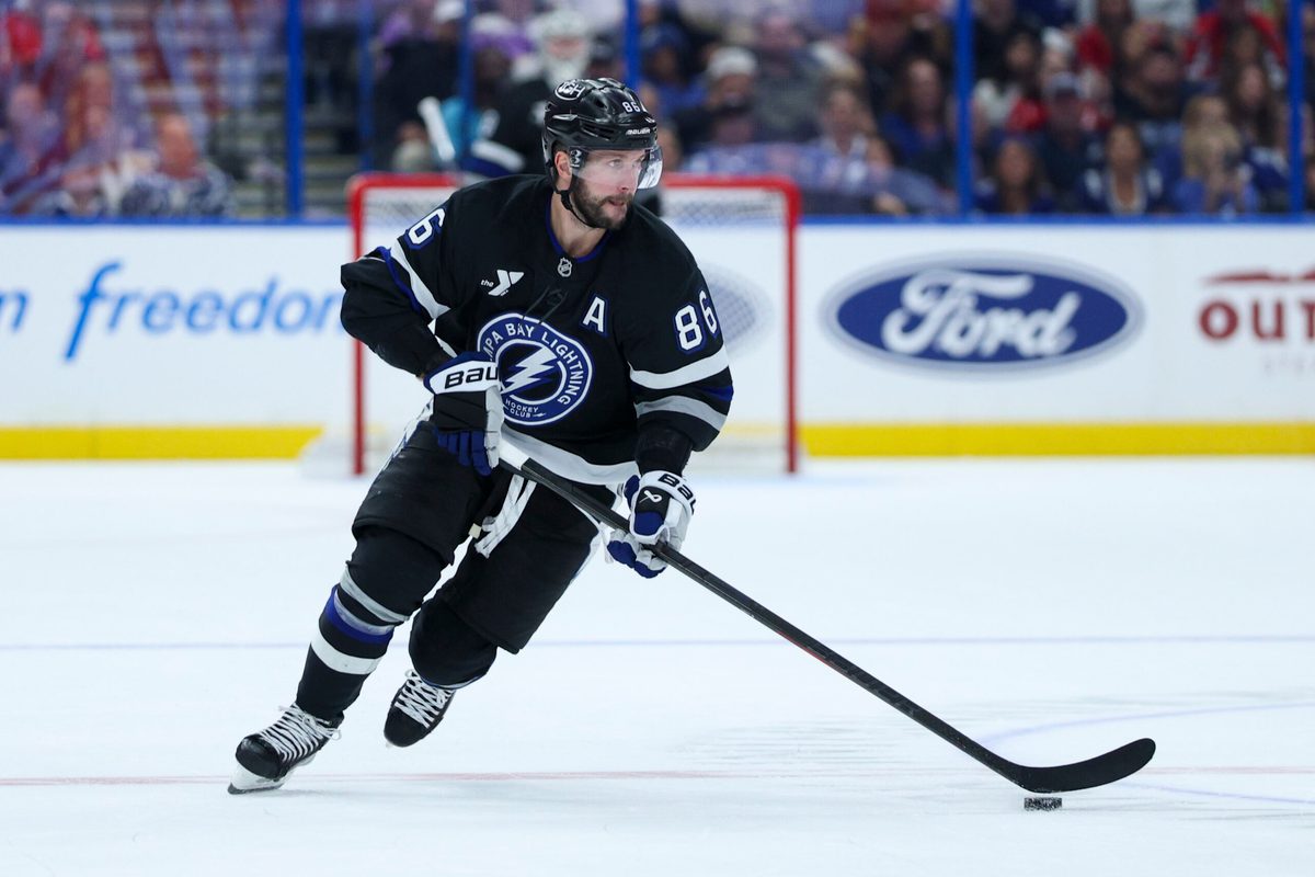 Nov 8, 2025; Tampa, Florida, USA; Tampa Bay Lightning right wing Nikita Kucherov (86) controls the puck against the Washington Capitals in the third period at Benchmark International Arena. Mandatory Credit: Nathan Ray Seebeck-Imagn Images