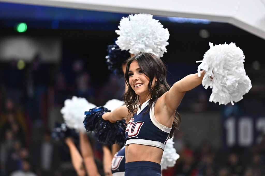 Nov 8, 2025; Spokane, Washington, USA; Gonzaga Bulldogs cheerleader performs during a game against the Oklahoma Sooners in the first half at Numerica Veterans Arena. Mandatory Credit: James Snook-Imagn Images