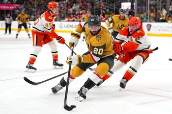 Nov 8, 2025; Las Vegas, Nevada, USA; Vegas Golden Knights left wing Brandon Saad (20) controls the puck ahead of Anaheim Ducks defenseman Jackson Lacombe (2) during the second period at T-Mobile Arena. Mandatory Credit: Stephen R. Sylvanie-Imagn Images