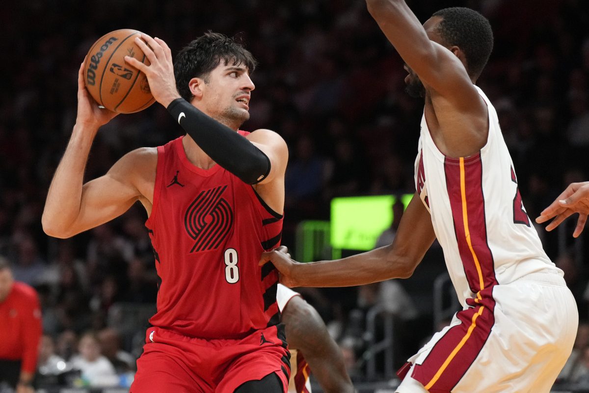 Nov 8, 2025; Miami, Florida, USA; Portland Trail Blazers forward Deni Avdija (8) looks to pass as Miami Heat forward Andrew Wiggins (22) defends during the second half at Kaseya Center. Mandatory Credit: Jim Rassol-Imagn Images