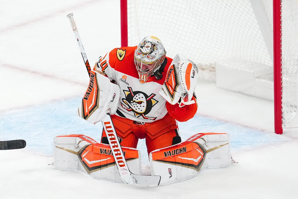Nov 8, 2025; Las Vegas, Nevada, USA; Anaheim Ducks goaltender Petr Mrazek (34) makes a save against the Vegas Golden Knights with the side of his mask during the third period at T-Mobile Arena. Mandatory Credit: Stephen R. Sylvanie-Imagn Images