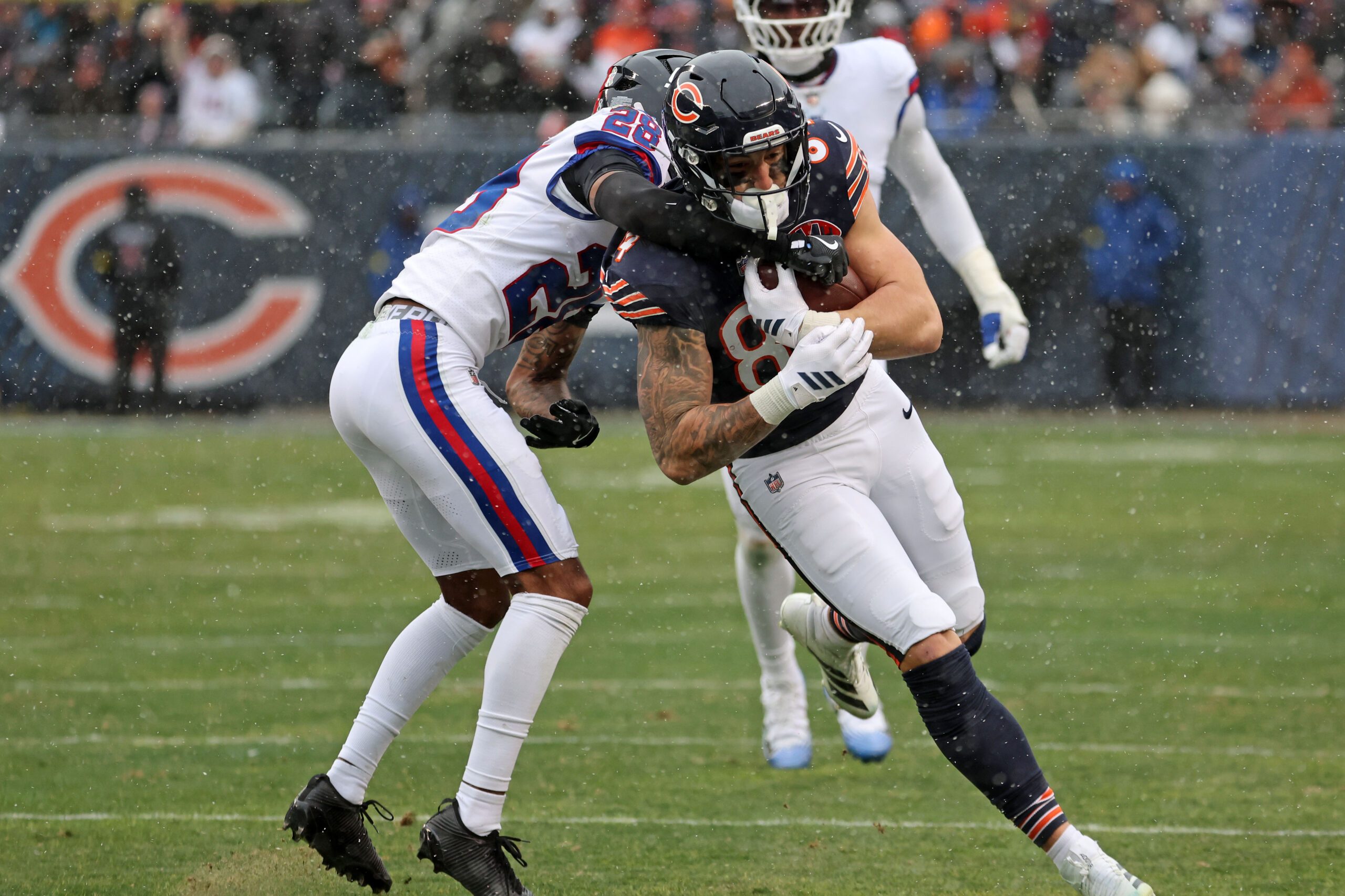 Nov 9, 2025; Chicago, Illinois, USA; Chicago Bears tight end Colston Loveland (84) makes a catch over New York Giants cornerback Cordale Flott (28) during the second half at Soldier Field. Mandatory Credit: Mike Dinovo-Imagn Images
