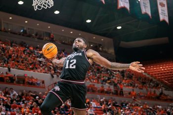 Nov 9, 2025; Stillwater, Oklahoma, USA; Texas A&M Aggies forward Rashaun Agee (12) dunks during the second half against the Oklahoma State Cowboys at Gallagher-Iba Arena. Mandatory Credit: William Purnell-Imagn Images