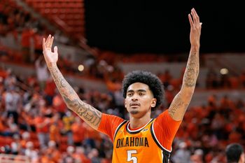 Nov 9, 2025; Stillwater, Oklahoma, USA; Oklahoma State Cowboys guard Vyctorius Miller (5) reacts to a play during the second half against the Texas A&M Aggies at Gallagher-Iba Arena. Mandatory Credit: William Purnell-Imagn Images