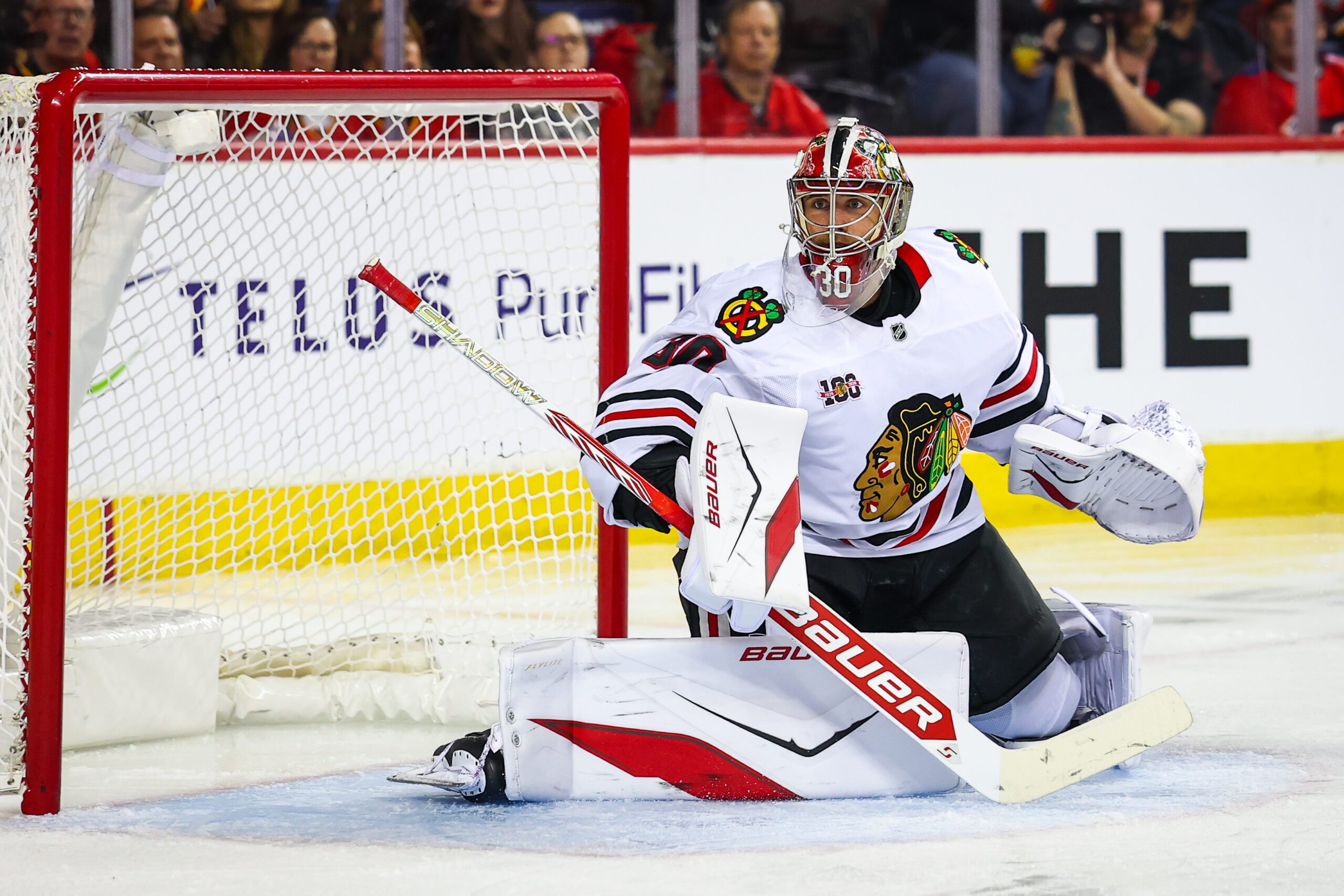 Nov 7, 2025; Calgary, Alberta, CAN; Chicago Blackhawks goaltender Spencer Knight (30) guards his net against the Calgary Flames during the second period at Scotiabank Saddledome. Mandatory Credit: Sergei Belski-Imagn Images