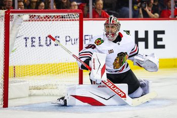 Nov 7, 2025; Calgary, Alberta, CAN; Chicago Blackhawks goaltender Spencer Knight (30) guards his net against the Calgary Flames during the second period at Scotiabank Saddledome. Mandatory Credit: Sergei Belski-Imagn Images
