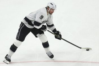 Nov 9, 2025; Pittsburgh, Pennsylvania, USA;  Los Angeles Kings right wing Adrian Kempe (9) shoots the puck against the Pittsburgh Penguins during the third period at PPG Paints Arena. Mandatory Credit: Charles LeClaire-Imagn Images