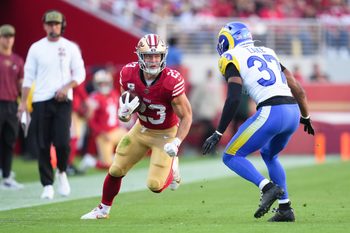 Nov 9, 2025; Santa Clara, California, USA; San Francisco 49ers running back Christian McCaffrey (23) runs the ball against Los Angeles Rams safety Quentin Lake (37) during the second quarter at Levi's Stadium. Mandatory Credit: Cary Edmondson-Imagn Images