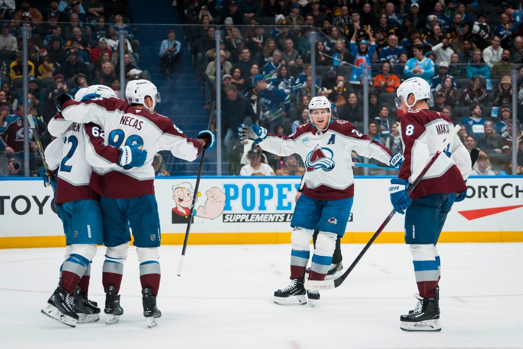 Nov 9, 2025; Vancouver, British Columbia, CAN; Colorado Avalanche forward Artturi Lehkonen (62) and forward Martin Necas (88) and forward Nathan MacKinnon (29) and defenseman Cale Makar (8) celebrate Lehkonen’s second gaol of the game against the Vancouver Canucks in the third period at Rogers Arena. Mandatory Credit: Bob Frid-Imagn Images