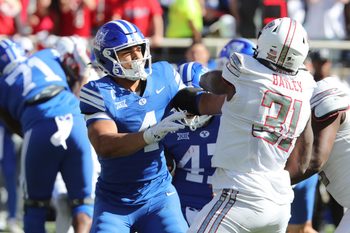 Nov 8, 2025; Lubbock, Texas, USA;  Texas Tech Red Raiders defensive lineman David Bailey (31) rushes against  Brigham Young Cougars running back LJ Martin (4) in the second half at Jones AT&T Stadium. Mandatory Credit: Michael C. Johnson-Imagn Images